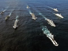 Pictured left to right: HDMS OLFERT FISCHER (Denmark), NRP ALVARES CABRAL (Portugal), SAS AMATOLA (South Africa), USS NORMANDY (USA), SAS ISANDLWANA (South Africa), HMCS TORONTO (Canada), and HNLMS EVERTSEN (The Netherlands). Front: SAS MANTHATISI (South Africa). Rear: FGS SPESSART (Germany).