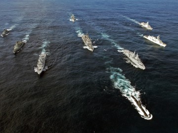 Pictured left to right: HDMS OLFERT FISCHER (Denmark), NRP ALVARES CABRAL (Portugal), SAS AMATOLA (South Africa), USS NORMANDY (USA), SAS ISANDLWANA (South Africa), HMCS TORONTO (Canada), and HNLMS EVERTSEN (The Netherlands). Front: SAS MANTHATISI (South Africa). Rear: FGS SPESSART (Germany).