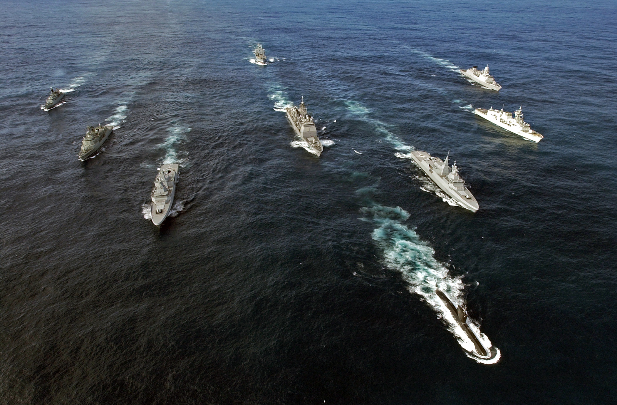 Pictured left to right: HDMS OLFERT FISCHER (Denmark), NRP ALVARES CABRAL (Portugal), SAS AMATOLA (South Africa), USS NORMANDY (USA), SAS ISANDLWANA (South Africa), HMCS TORONTO (Canada), and HNLMS EVERTSEN (The Netherlands). Front: SAS MANTHATISI (South Africa). Rear: FGS SPESSART (Germany).
